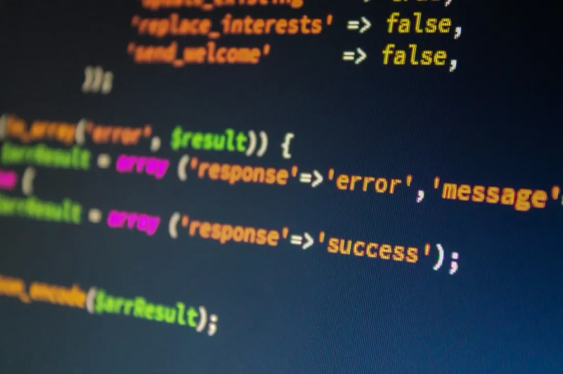 Close-up of programming code on a screen, illustrating the cybersecurity workforce gap