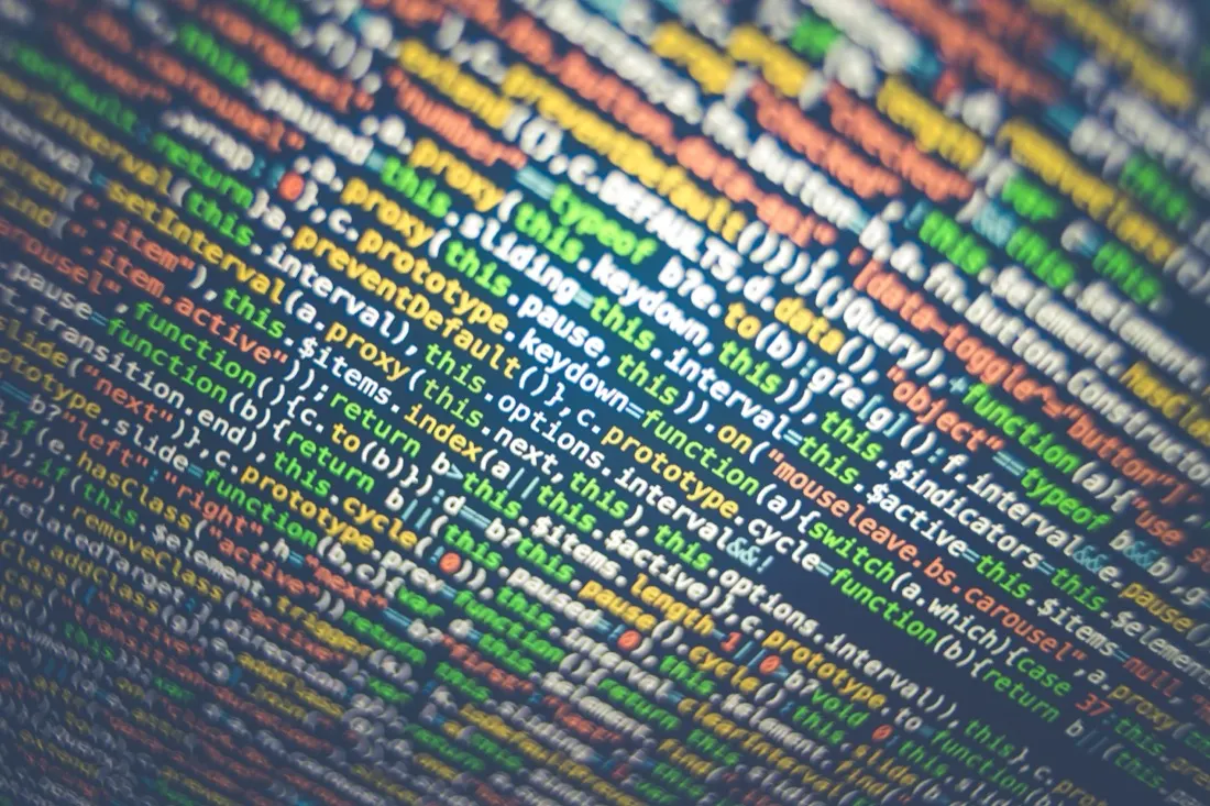 Close-up of colourful computer code on a screen, illustrating government data trust issues