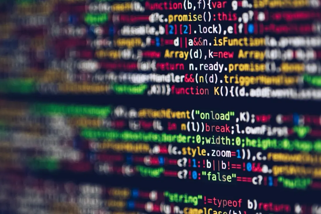 A close-up of colourful lines of computer code on a screen, illustrating data security practices during the pandemic