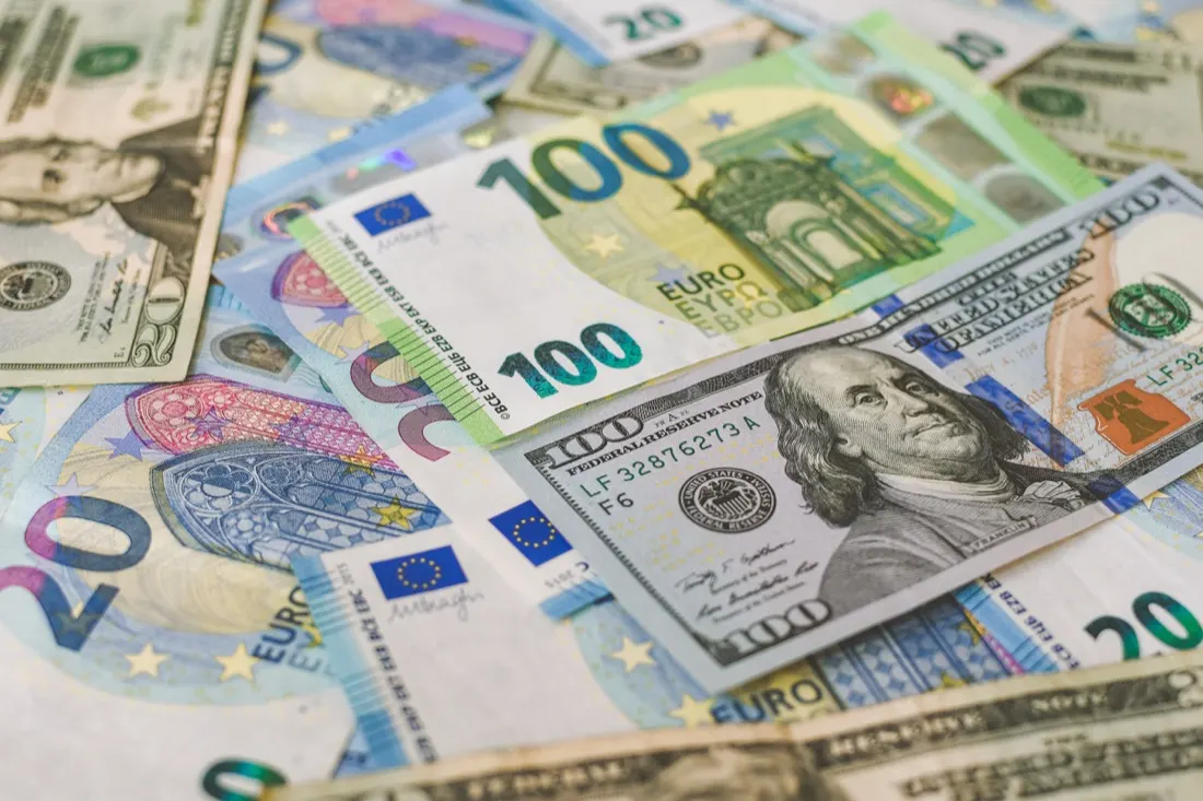 Close-up of overlapping dollar and euro banknotes, illustrating venture capital funding sources