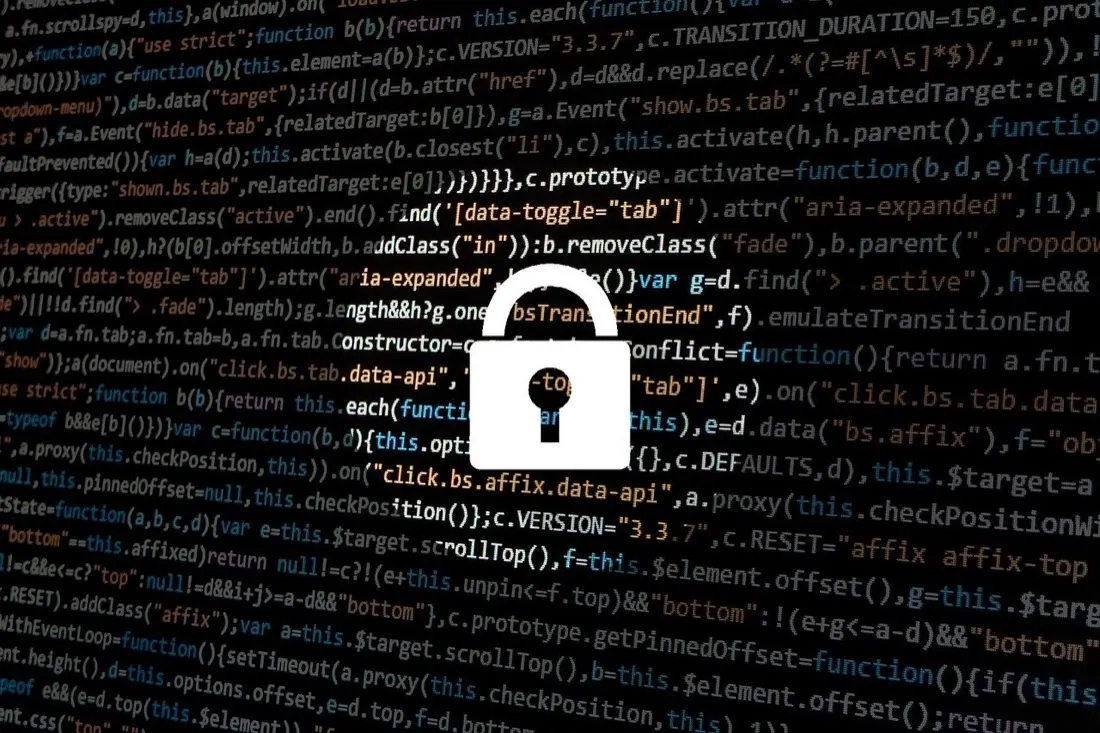 A padlock icon overlaid on lines of computer code, illustrating growing fraud threats